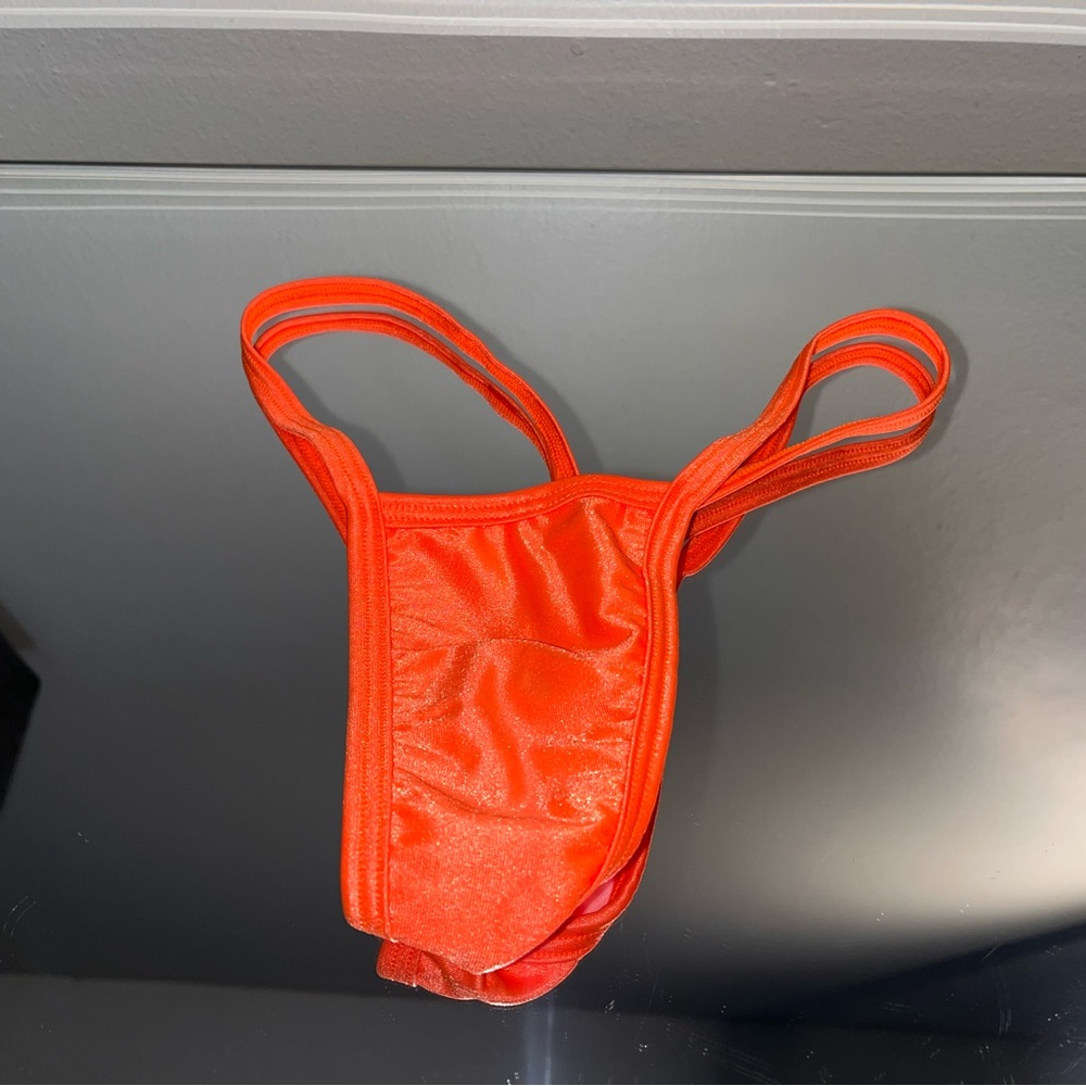 Bright orange stripper G string